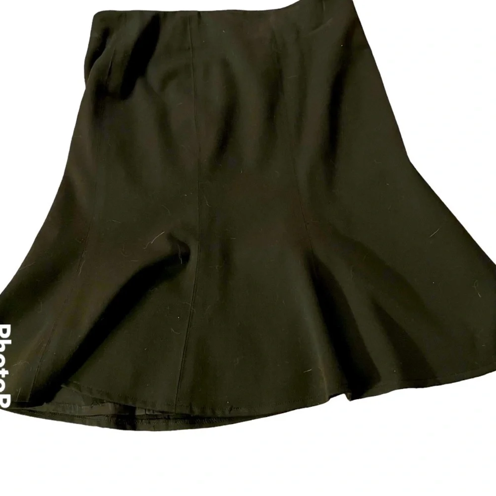 Avenue Montaigne black wool “mermaid” skirt, fully lined. Size 0.